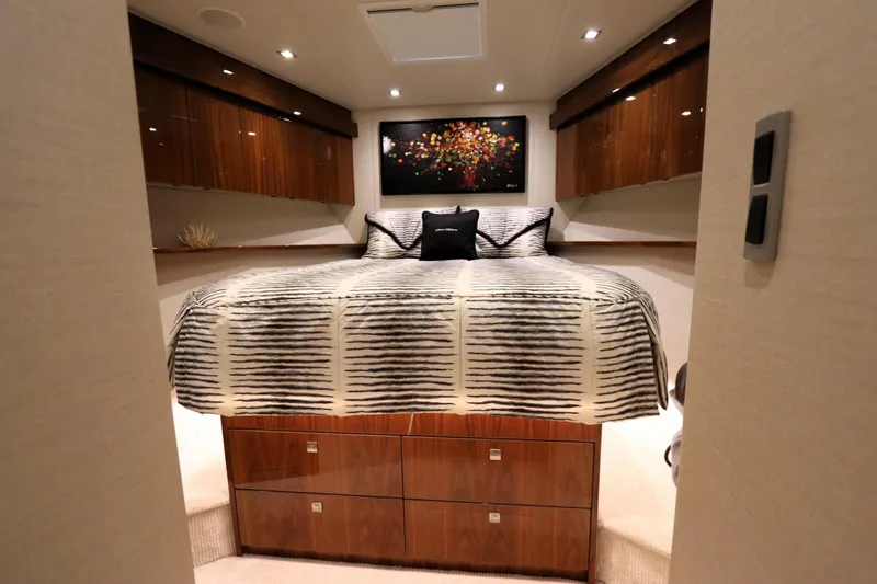 Slide: The Image of Luxurious bedroom interior of 2017 Viking 80 Enclosed Bridge yacht with modern decor. - 28