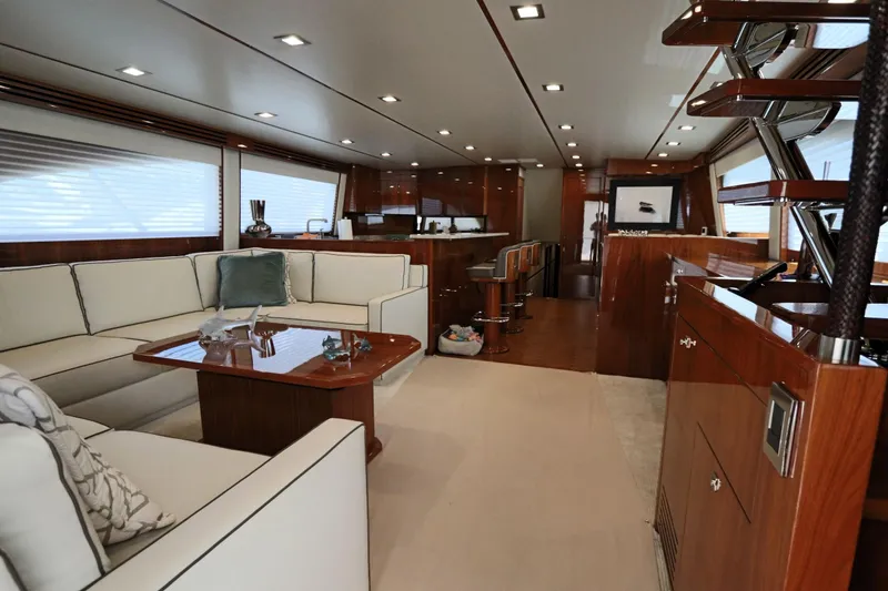 Slide: The Image of Luxurious interior of 2017 Viking 80 Enclosed Bridge yacht with elegant seating and wood finishes. - 3