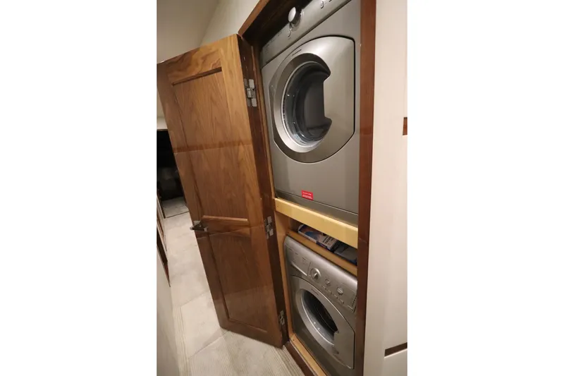 Slide: The Image of Stacked washer and dryer in 2017 Viking 80 Enclosed Bridge yacht. - 33