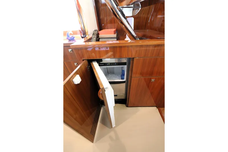 Slide: The Image of Luxury yacht interior with open mini fridge, Viking 80 Enclosed Bridge, 2017 model. - 34