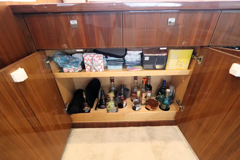 Slide: The Image of Luxury yacht bar cabinet with assorted drinks and accessories, Viking 80 Enclosed Bridge, 2017 model. - 36