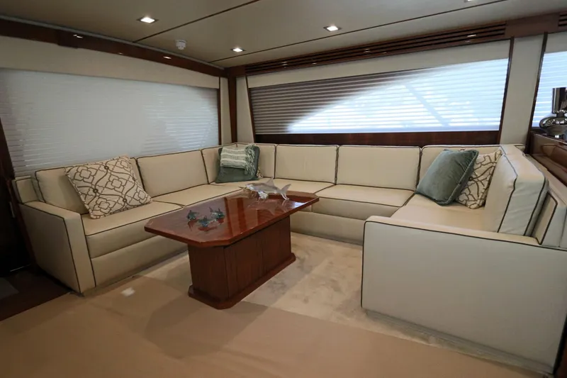 Slide: The Image of Luxurious interior of 2017 Viking 80 Enclosed Bridge yacht with elegant seating and table. - 4