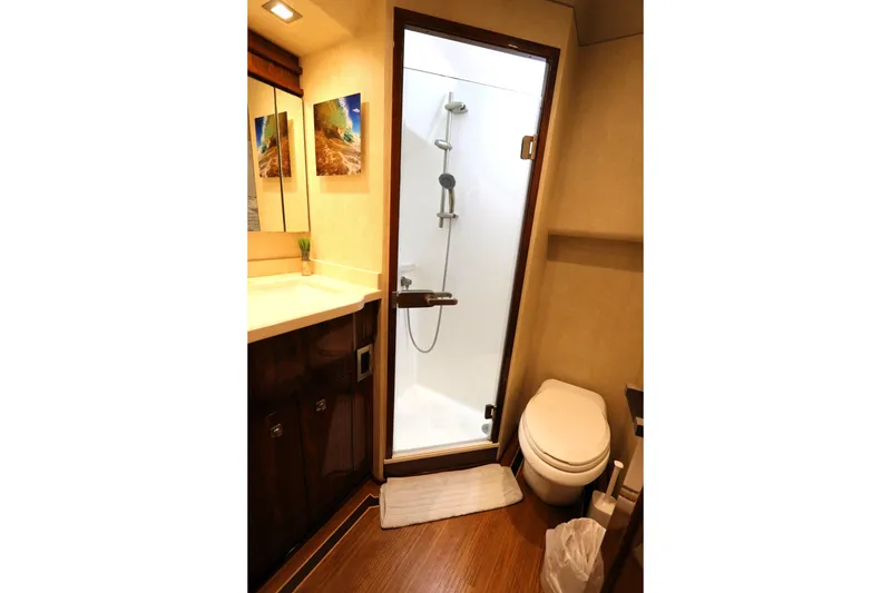 Slide: The Image of Luxurious bathroom in 2017 Viking 80 Enclosed Bridge yacht with shower and toilet. - 42