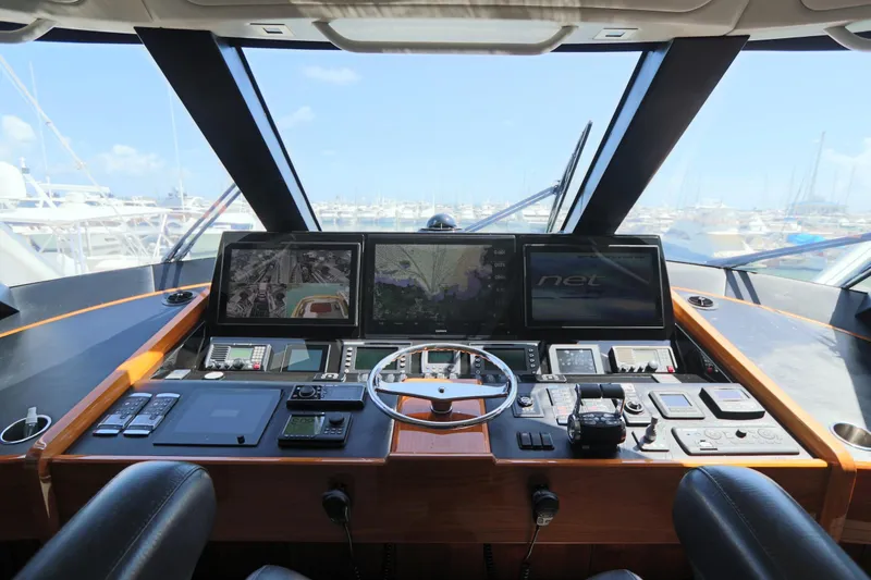 Slide: The Image of Cockpit of 2017 Viking 80 Enclosed Bridge yacht with advanced navigation systems. - 49