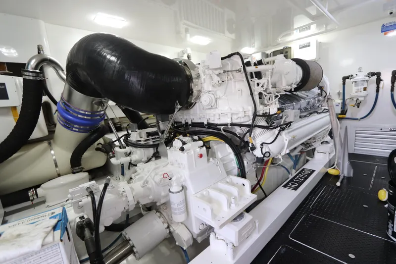 Slide: The Image of Engine room of 2017 Viking 80 Enclosed Bridge yacht, showcasing powerful machinery and components. - 55