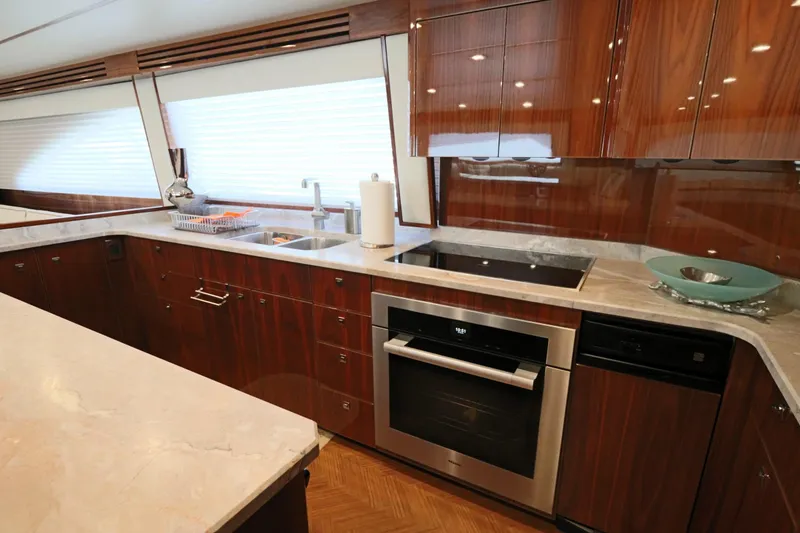 Slide: The Image of Luxurious kitchen interior of 2017 Viking 80 Enclosed Bridge yacht with modern appliances. - 8