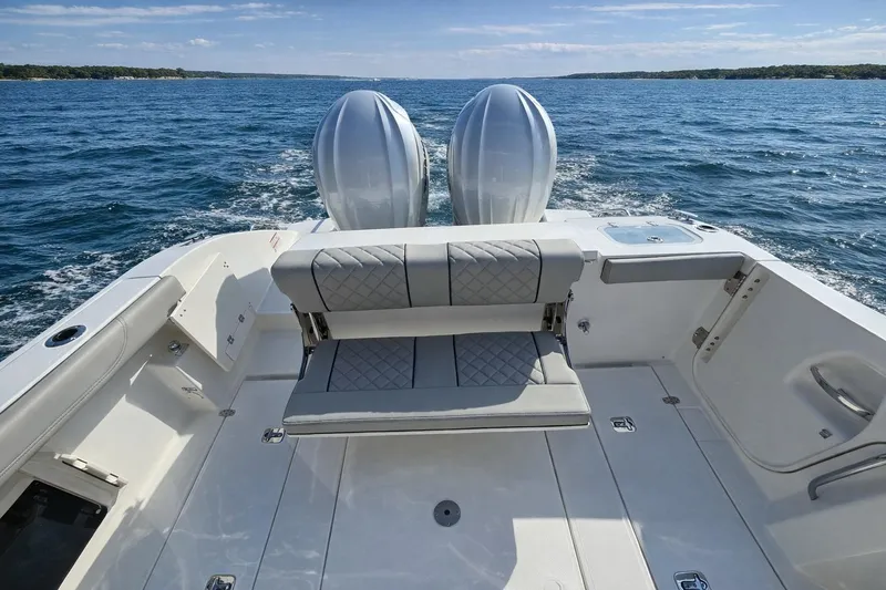 Slide: The Image of 2025 Pursuit S 288 Sport boat with dual engines on open water. - 3