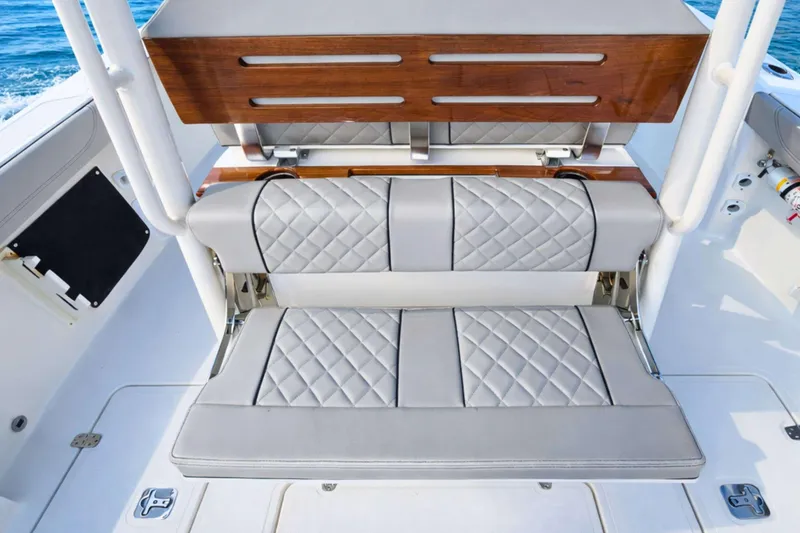 Slide: The Image of 2025 Pursuit S 288 Sport boat with luxurious quilted seating and wooden accents. - 6