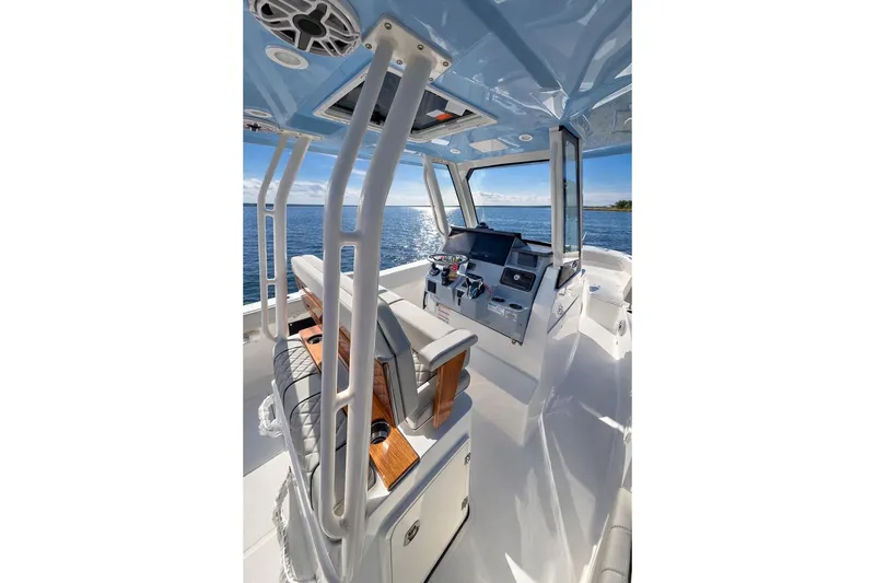 Slide: The Image of 2025 Pursuit S 288 Sport boat with dual engines on open water. - 7