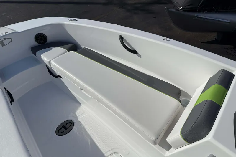 Slide: The Image of 2022 Tahoe T18 boat interior with cushioned seating and speaker. - 10