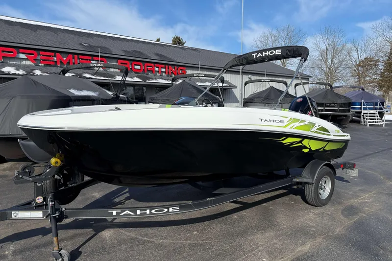 Slide: The Image of 2022 Tahoe T18 boat on trailer at Premier Boating dealership. - 11