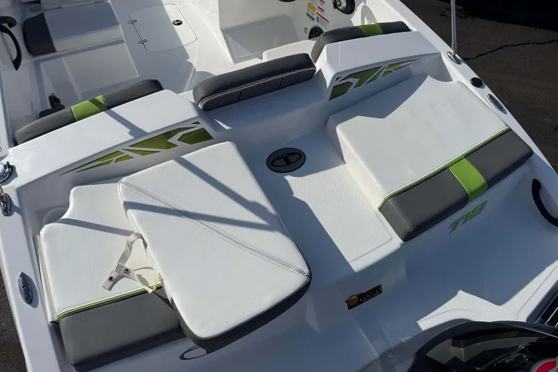 Slide: The Image of 2022 Tahoe T18 boat interior with white and green cushioned seating. - 4