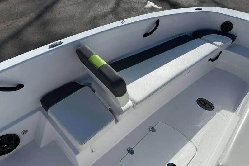Slide: The Image of 2022 Tahoe T18 boat interior with white seating and green accents. - 9