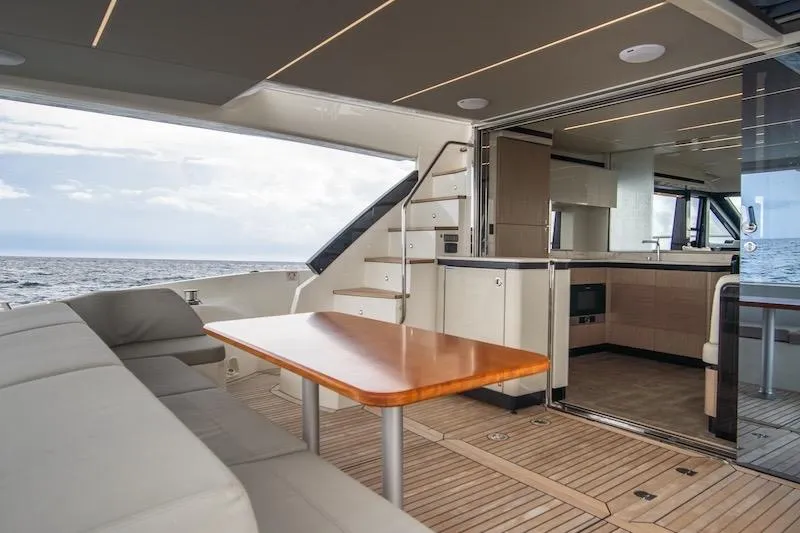 Slide: The Image of Luxurious 2023 Absolute 62 Fly yacht interior with modern kitchen and ocean view. - 15