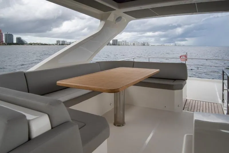 Slide: The Image of Luxurious seating area on 2023 Absolute 62 Fly yacht with ocean view. - 23
