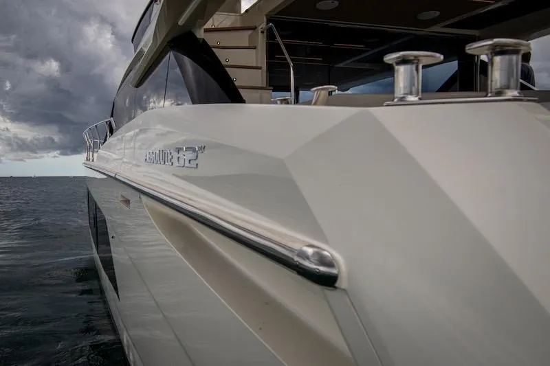 Slide: The Image of 2023 Absolute 62 Fly yacht on water under cloudy sky. - 31