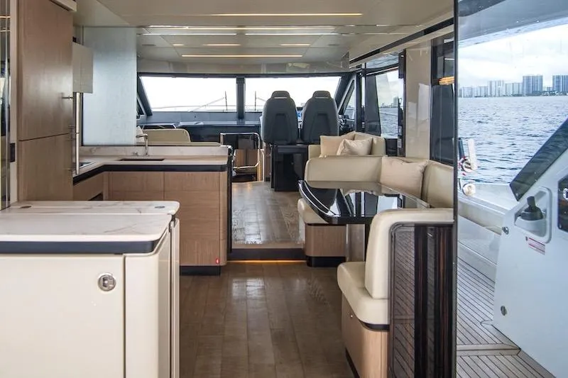 Slide: The Image of Luxurious interior of 2023 Absolute 62 Fly yacht with modern furnishings and panoramic windows. - 32