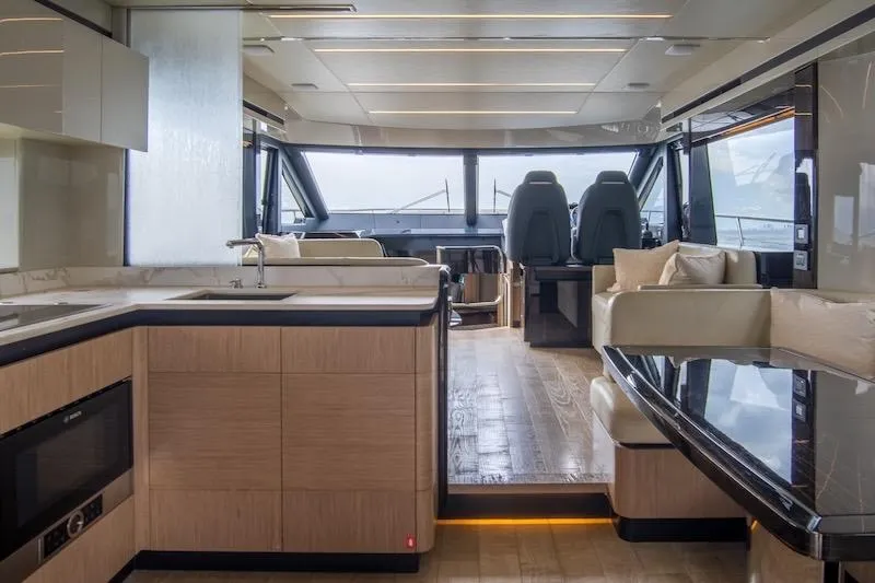 Slide: The Image of Luxurious interior of 2023 Absolute 62 Fly yacht with modern kitchen and seating area. - 35