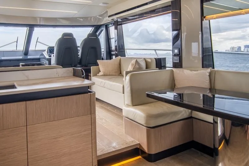 Slide: The Image of Luxurious interior of 2023 Absolute 62 Fly yacht with modern seating and ocean view. - 36
