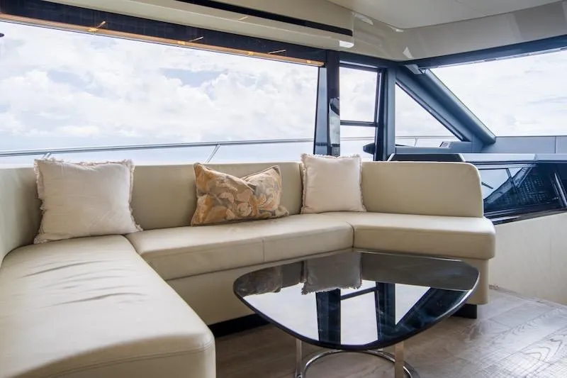 Slide: The Image of Luxurious interior of 2023 Absolute 62 Fly yacht with elegant seating and panoramic windows. - 38