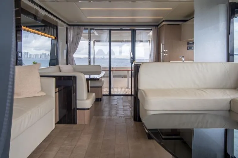 Slide: The Image of Luxurious interior of 2023 Absolute 62 Fly yacht with elegant seating and ocean view. - 39