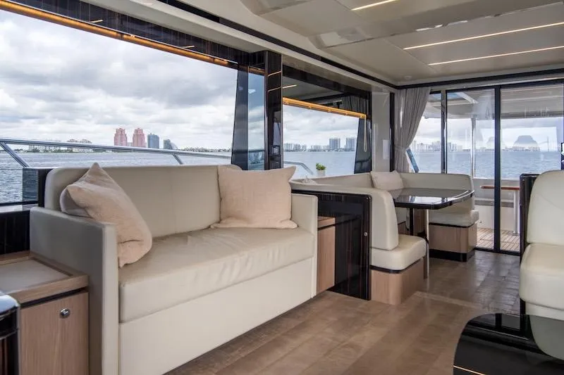 Slide: The Image of Luxurious interior of 2023 Absolute 62 Fly yacht with elegant seating and panoramic windows. - 40
