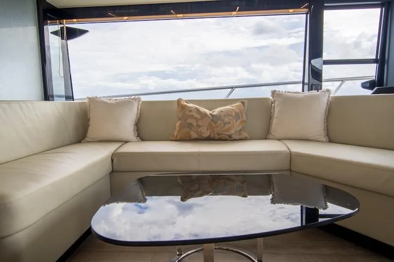 Slide: The Image of Luxurious interior of 2023 Absolute 62 Fly yacht with elegant seating and glass table. - 43