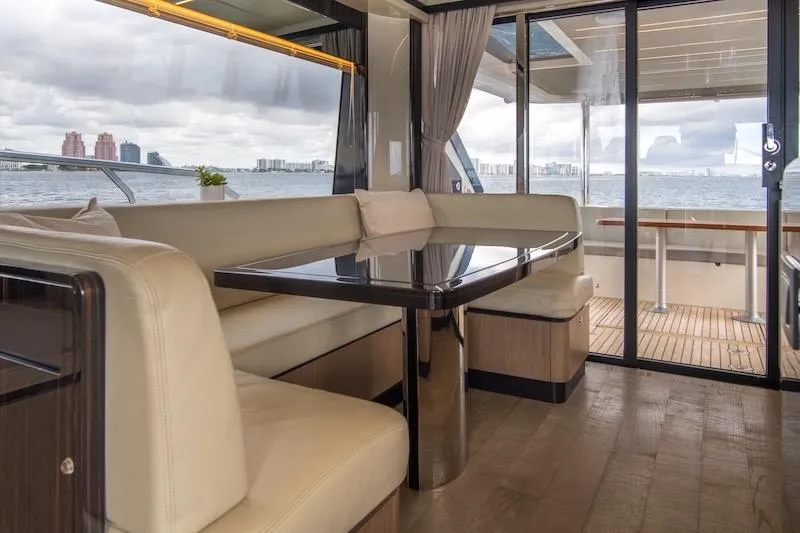 Slide: The Image of Luxurious interior of 2023 Absolute 62 Fly yacht with elegant seating and ocean view. - 44