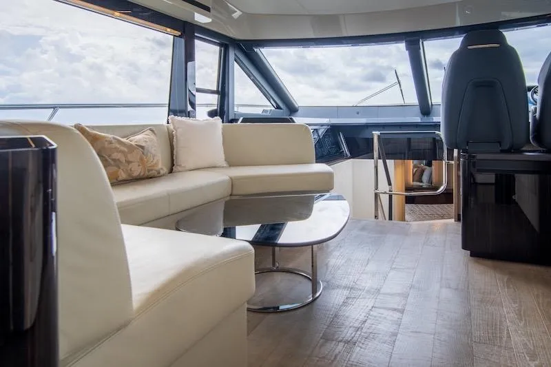 Slide: The Image of Luxurious interior of 2023 Absolute 62 Fly yacht with modern seating and panoramic windows. - 45