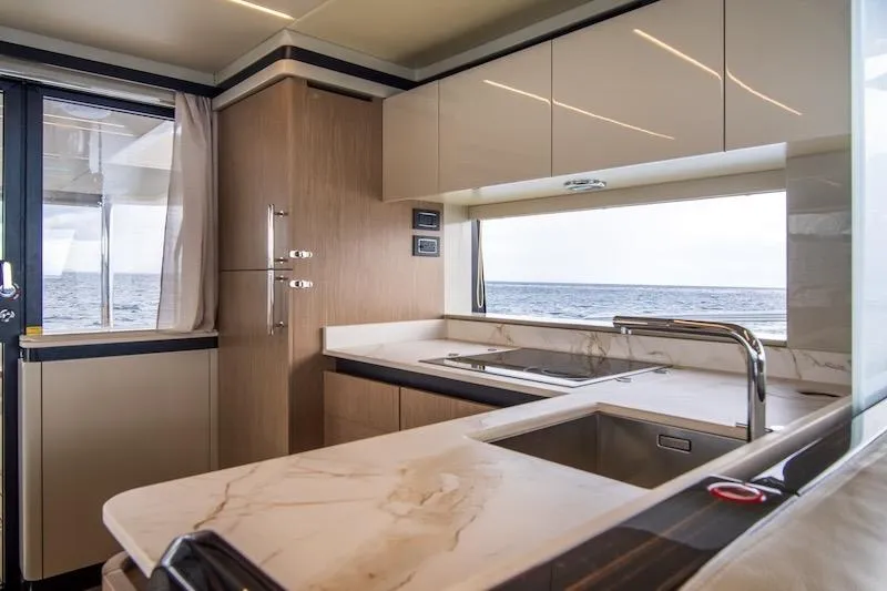 Slide: The Image of Luxurious kitchen interior of 2023 Absolute 62 Fly yacht with ocean view. - 47