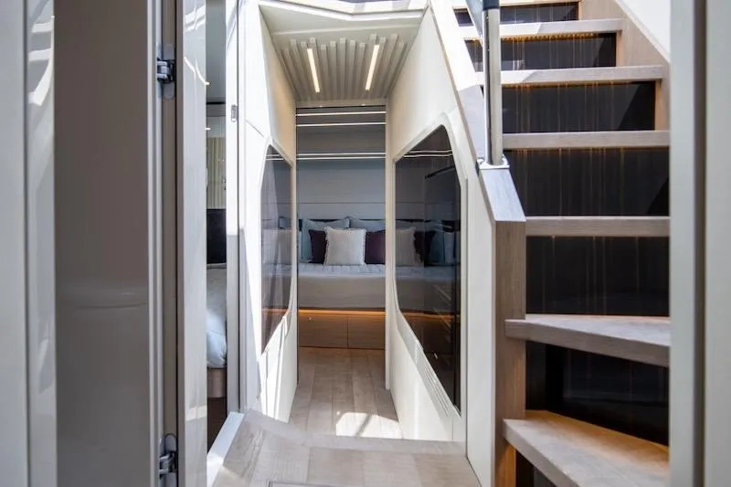 Slide: The Image of Luxurious interior of 2023 Absolute 62 Fly yacht with modern staircase and elegant design. - 54