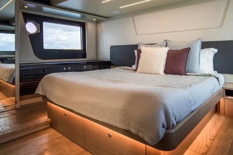 Slide: The Image of Luxurious bedroom interior of 2023 Absolute 62 Fly yacht with modern design and cozy bedding. - 56