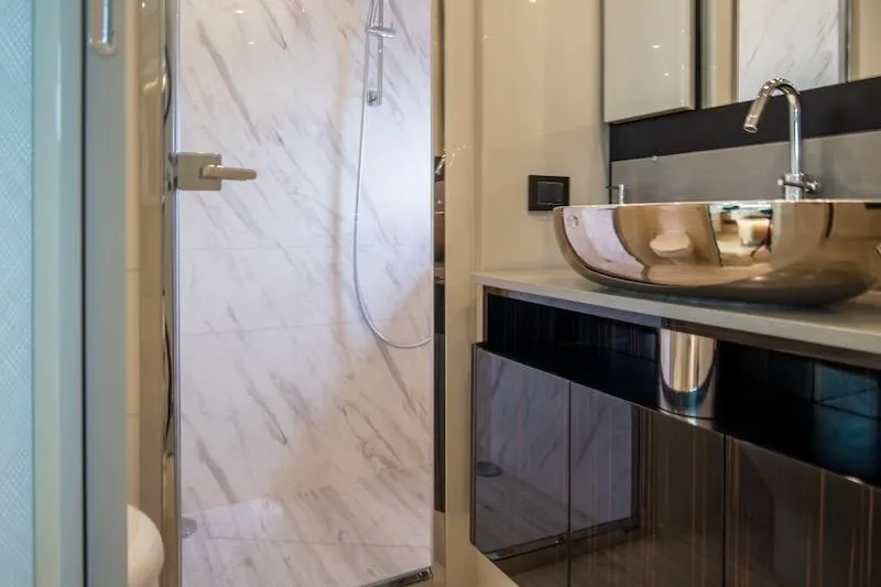 Slide: The Image of Luxurious bathroom in 2023 Absolute 62 Fly yacht with modern sink and shower. - 59