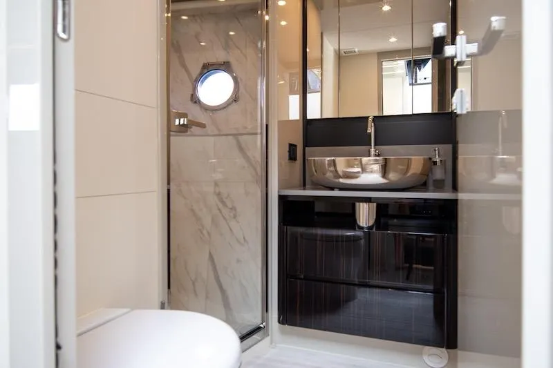 Slide: The Image of Luxurious bathroom in 2023 Absolute 62 Fly yacht with modern fixtures and elegant design. - 61