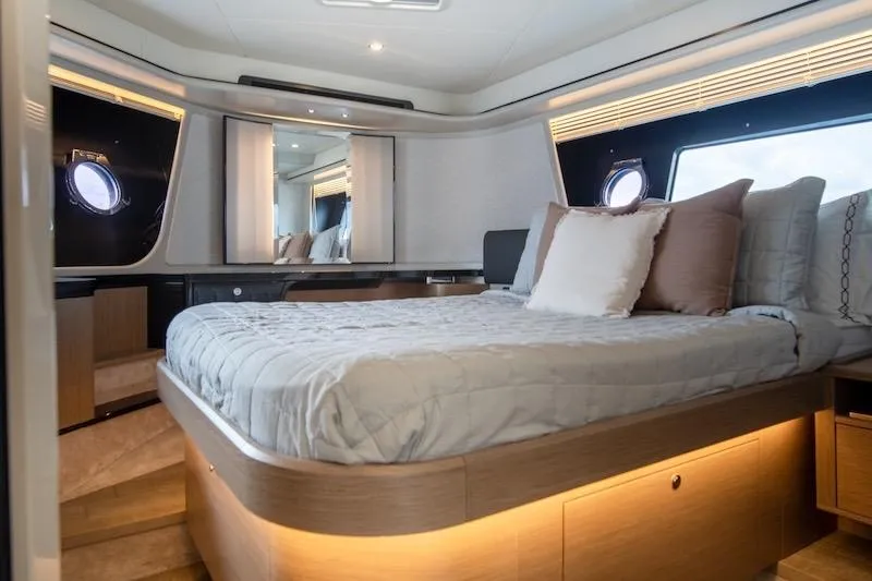 Slide: The Image of Luxurious bedroom interior of 2023 Absolute 62 Fly yacht with modern design and ambient lighting. - 63