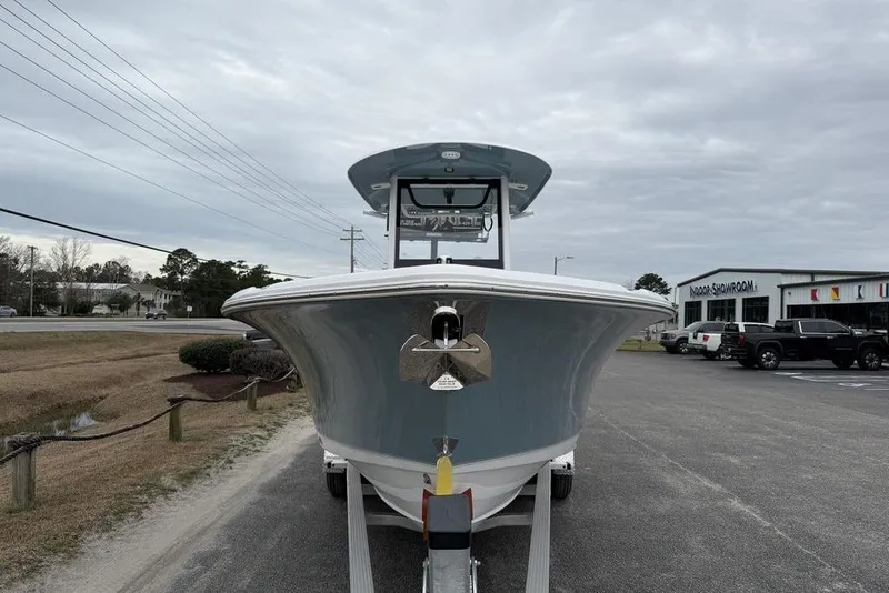 Slide: The Image of 2026 Sea Hunt Ultra 265 SE boat on trailer, outdoor showroom background. - 11