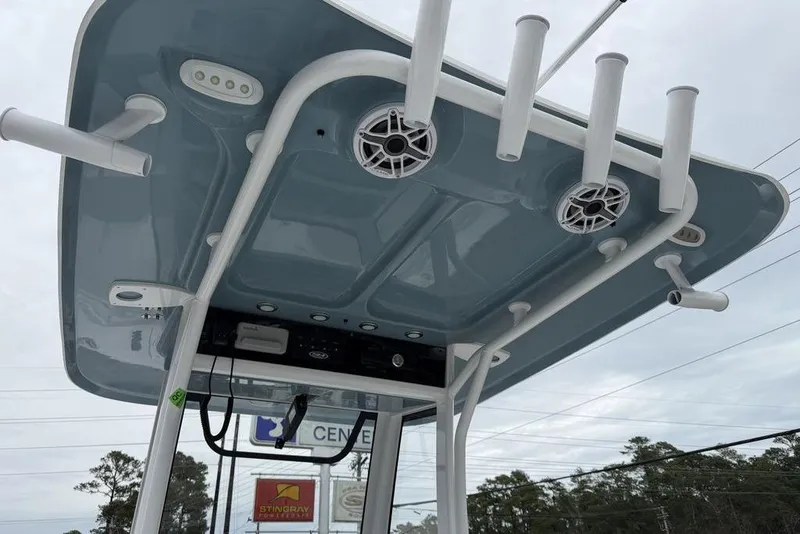 Slide: The Image of 2026 Sea Hunt Ultra 265 SE boat top with rod holders and speakers. - 17