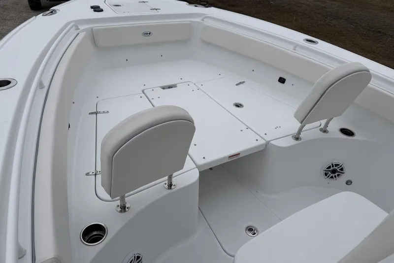 Slide: The Image of 2026 Sea Hunt Ultra 265 SE boat interior with white seating and deck layout. - 5