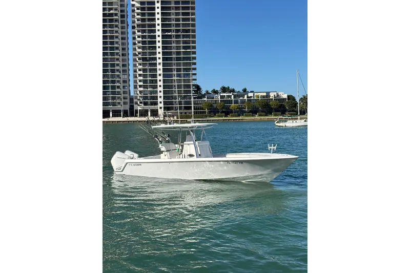 The Image of 2025 Contender 30 Tournament boat on water near city skyline. - 0