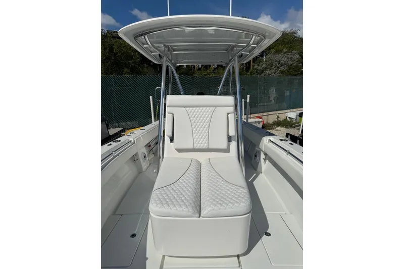 Slide: The Image of 2025 Contender 30 Tournament boat with sleek white seating and modern design. - 10