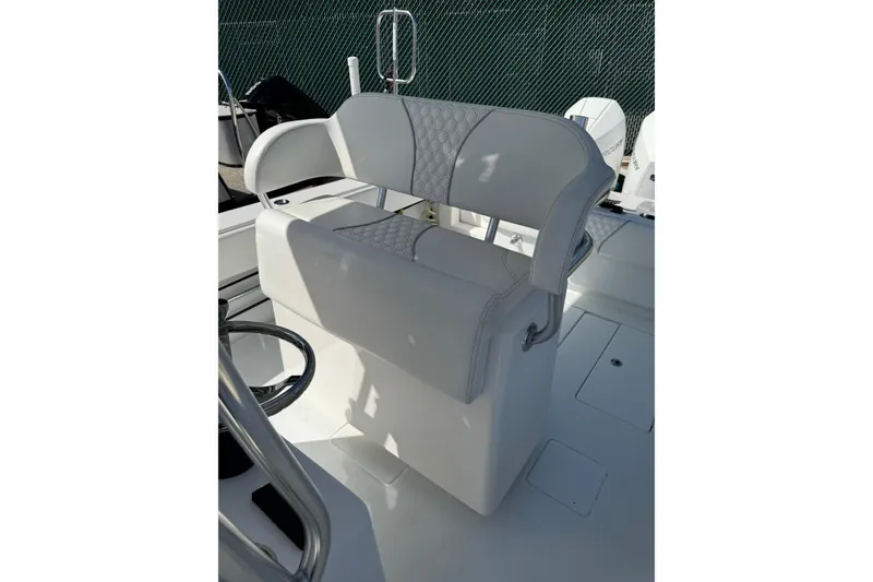 Slide: The Image of Contender 30 Tournament 2025 boat seat with quilted design and steering wheel. - 13