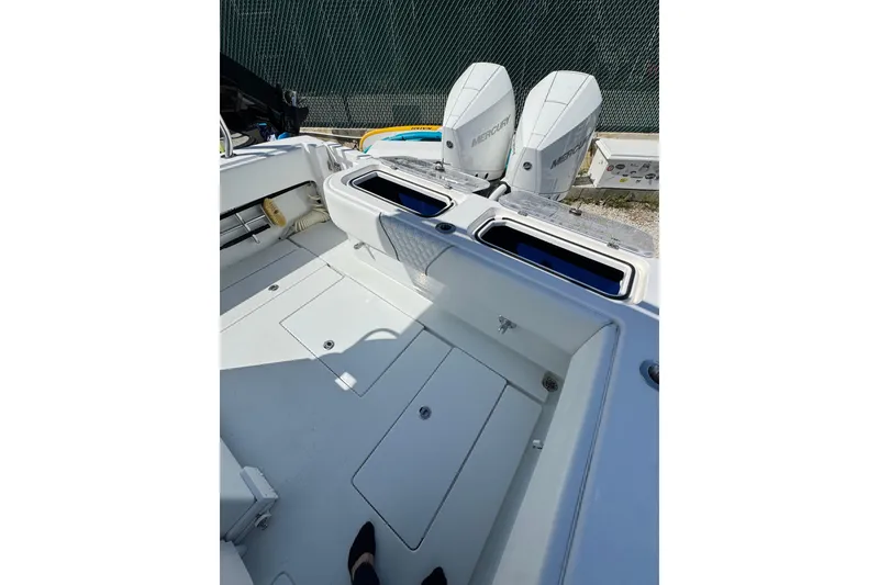 Slide: The Image of 2025 Contender 30 Tournament boat interior with dual Mercury engines, showcasing spacious deck layout. - 14
