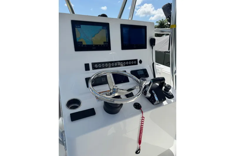 Slide: The Image of Helm of 2025 Contender 30 Tournament boat with navigation screens and controls. - 16