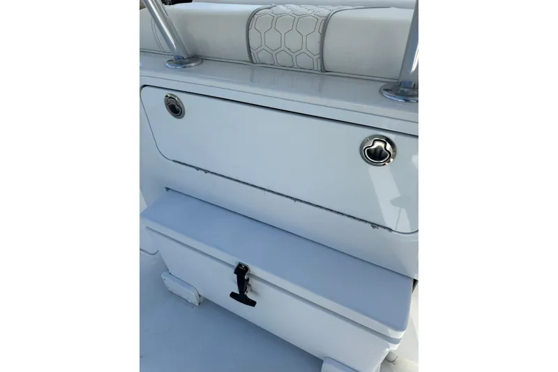 Slide: The Image of 2025 Contender 30 Tournament boat storage compartment with sleek white design and secure latch. - 18