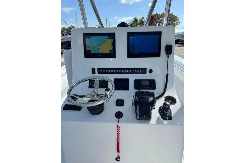 Slide: The Image of 2025 Contender 30 Tournament boat dashboard with navigation screens and controls. - 2