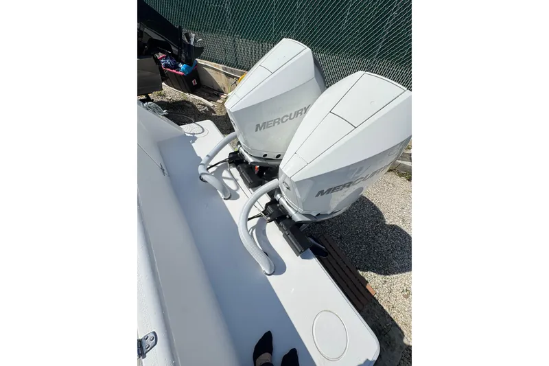 Slide: The Image of 2025 Contender 30 Tournament boat with dual Mercury outboard engines. - 21