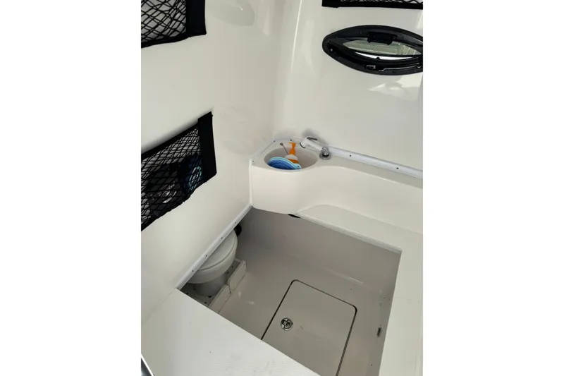 Slide: The Image of Interior of 2025 Contender 30 Tournament boat, featuring a compact bathroom area. - 25