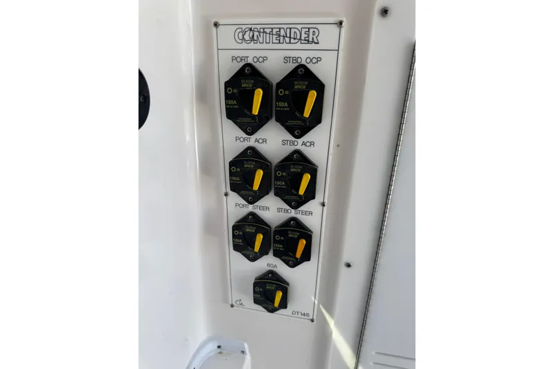 Slide: The Image of Control panel of 2025 Contender 30 Tournament boat with labeled switches and dials. - 27