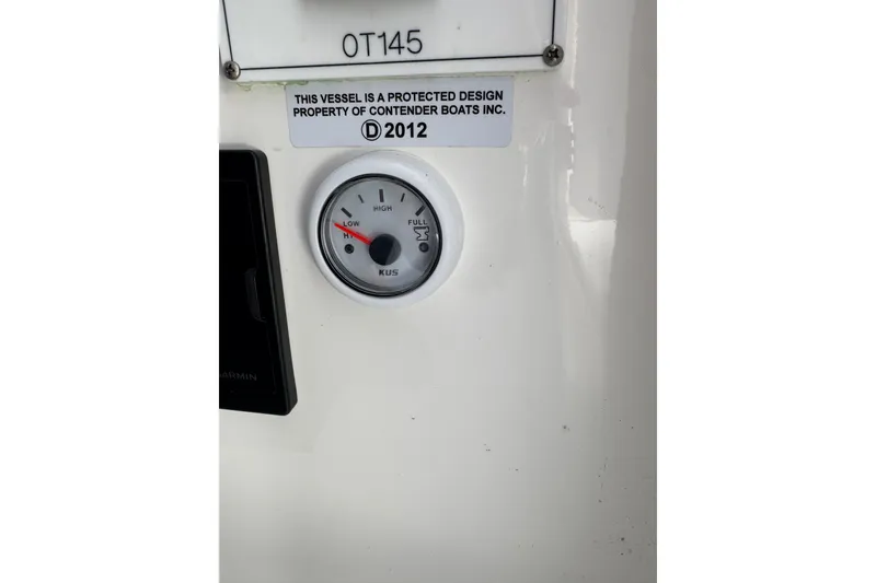 Slide: The Image of Fuel gauge and design label on 2025 Contender 30 Tournament boat dashboard. - 29