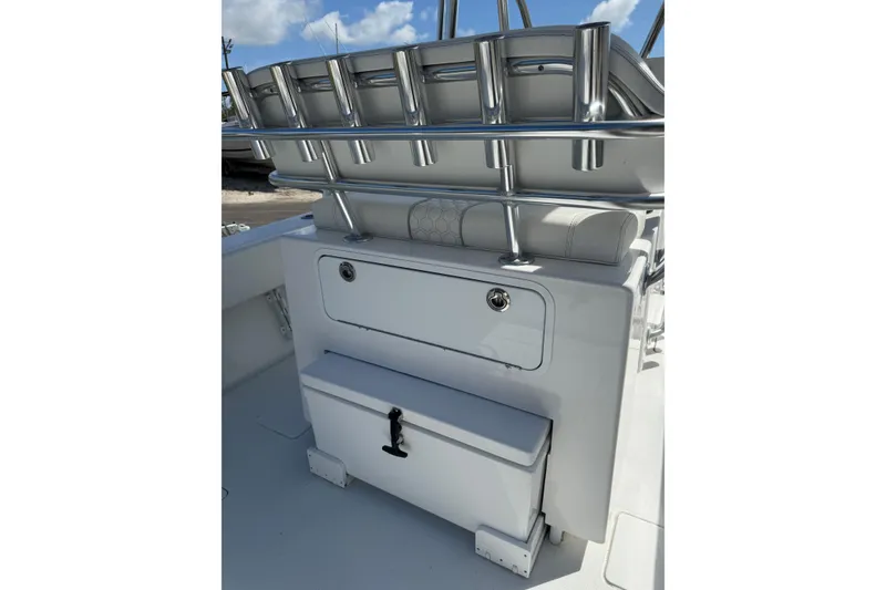 Slide: The Image of 2025 Contender 30 Tournament boat interior with rod holders and storage compartments. - 5